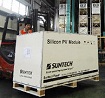 a worker forklifts solar panel products at Suntech Power in Wuxi, east China's Jiangsu Province
