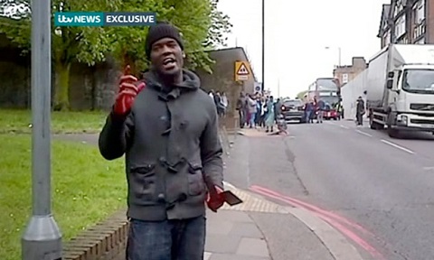 Footage obtained by ITV which purports to show two men believed to be involved in a 'serious incident' in Woolwich, south east London, on Wednesday which has left one person dead and two others injured. The man, holding what appears to be a machete, talks to a passersby with the victim of the incident laying behind him in the road