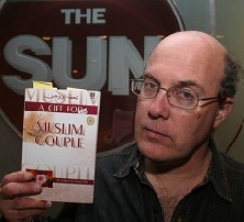 Eric Brazau holds his copy of A Gift For the Muslim Couple in the front lobby of the Toronto Sun