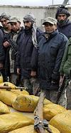 Afghan Border Police (ABP) members provide security during the processing of illegal narcotics which were seized during an ambush on 14 Dec 2008