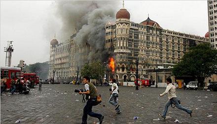 Flames and smoke poured from the Taj hotel in Mumbai, India