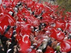 People wave Turkish flags during an anti-Pope rally organised by the Islam-based Welfare Party in Istanbul November 26, 2006. Pope Benedict XVI is expected to arrive in Turkey on Tuesday. (Pawel Kopczynski/Reuters)