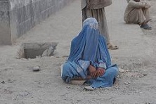 Burqa clad woman resting in Kabul