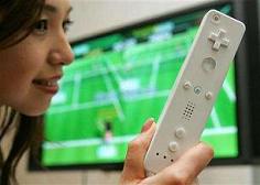 A Nintendo Co. Ltd. employee demonstrates the company's next-generation game console Wii before their corporate strategy meeting in Tokyo June 7, 2006. Nintendo Co. Ltd. said it would voluntarily exchange globally 3.2 million straps attached to the controllers of its Wii game console with stronger ones after some reports of broken straps. REUTERS/Issei Kato