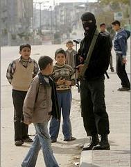 gaza thug surrounding himself with children as shields