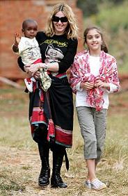 Madonna with David Banda, the boy she adopted from Malawi, and daughter Lourdes (Malawi 2007)