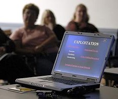 Parents listen to a seminar conducted by Connecticut State Police cybercrimes unit