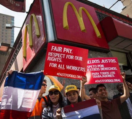 Dozens of fast food workers held a demonstration outside of a McDonald's in Manhattan 15 May 2014. They were part of a worldwide day of protests in 230 cities. 