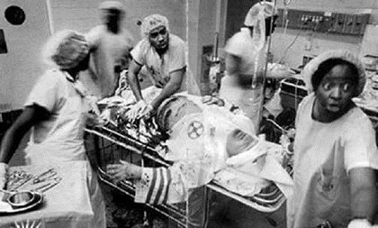 KKK in black operating room