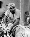 KKK in black operating room