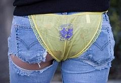 She was laughing with some friends as we approached. We noticed her yellow panties on the outside of her pants. She turned around to give us a better look. I asked permission to take a photo. She said yes. I then got down to ass level and snapped this pic. =)