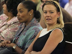 O.J. Simpson's daughter, Arnelle Simpson, center, and his girlfriend Christine Prody, right, sit together in a Clark County Justice courtroom during Simpson's arraignment in Las Vegas, Wednesday, Sept. 19, 2007.