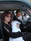 The Kartuzov family in their new UAZ-Patriot SUV, which they won as a grand prize in a regional contest titled: Give Birth to a Patriot on Russia's Independence Day.