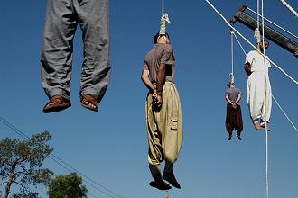 Four Iranian criminals are hanged in public in the southern city of Shiraz 05 September 2007. Iran executed today 21 criminals in a single day, the latest of a growing number of executions in a crackdown which officials say is aimed at improving security in society. AFP PHOTO/STR