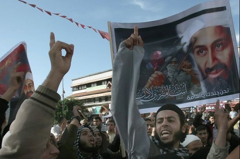Palestinian Sunni Muslim fundamentalists hold up images of Osama bin Laden during a protest in Gaza city on May 7, 2011, denouncing the U.S. Navy SEALs operation in which bin Laden was killed in the city of Abbottabad in northeastern Pakistan on May 2.