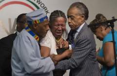 Esaw Garner, wife of Eric Garner, breaks down during a rally for her late husband on July 19 in New York