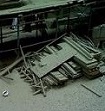 fallen worker behind scaffolding. apparently the bucket dropped cement from the top causing floors to collapse and 2 workers to fall, 1 being caught in the safety net.