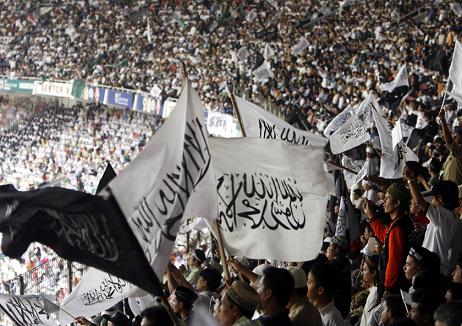 More than 70,000 members of a Muslim group have held a rally in Indonesia calling for a caliphate - or Islamic rule - to govern the world.