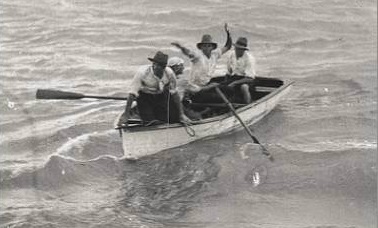 U. S. Navy destroyer stops four Mexicans in a rowboat rowing towards California