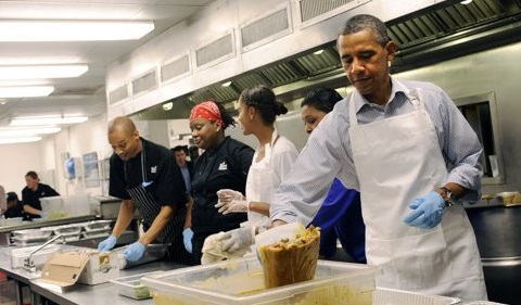 U.S. President Barack Obama (R) with daughter Malia Obama, and, from left, Jeffrey Ragsdale, Jamillah Linkins, and Marianne Ali, participate in a service project to commemorate the 9/11 anniversary at DC Central Kitchen September 10, 2011 in Washington, DC. The First Family packaged meals that will go to organizations such as DC Public Schools, Covenant House Washington, and New Endeavors by Women