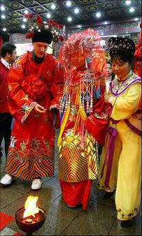 a traditional Chinese wedding ceremony held in Yu Garden, a famous Chinese garden in Shanghai.