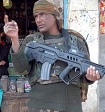 March 01, 2008: An Indian trooper holding an Israel made Tavor Assault Rifle (TAR-21) at a market in the center of the Kashmir valley. The rifles developed by Israel for usage in urban warfare are part of India's strategy to modernize its army especially while dealing with Muslim terrorists in the country.