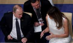 American first lady Melania Trump and Russian president Putin sitting at dinner at the G20 Summit in Germany.