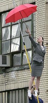 The 21-year-old actress is emulating the famous scene from Disney's 1964 film Mary Poppins, where Julie Andrews floats over London clutching her umbrella. Scarlett Johansson's scenes are part of a dream sequence in which she soars high above New York City.