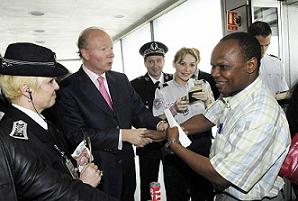 France's new Immigration, Integration and National Identity Minister, Brice Hortefeux toured Charles de Gaulle airport on his first day on the job. He has said he intends to pay more immigrants to return home.