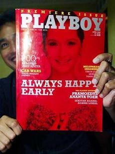 Erwin Arnanda, publisher of the Indonesian version of Playboy magazine, holds the first edition. Photo: Reuters