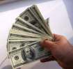 stack of hundred dollar bills