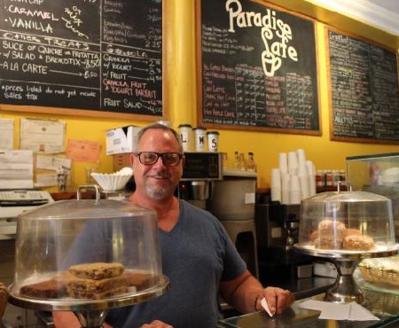Owner Michael Turowski behind the counter on Paradise Cafe's last day